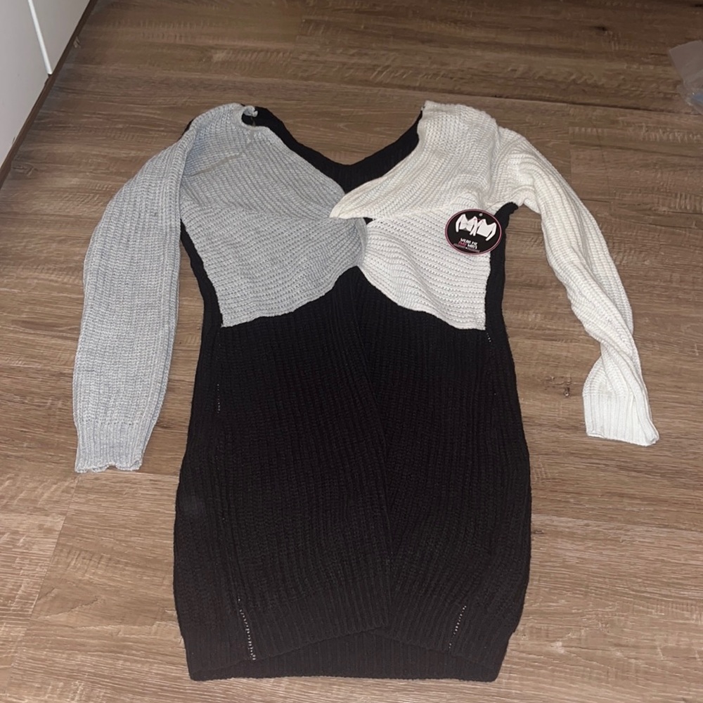 Sweater dress. Never worn. Can wear it two ways. Great condition.